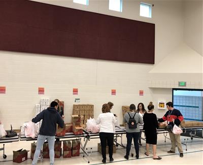 Cyprus employees bagging food for kids. 