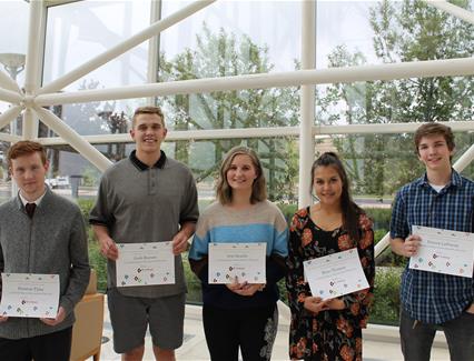 High school scholarship winners with their certificates 