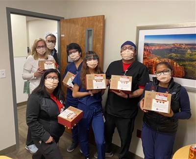 Medical workers holding boxed lunches